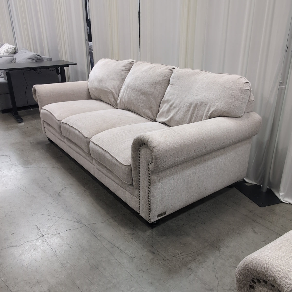 Light Beige Rolled Arm Couch with Nailhead Trim