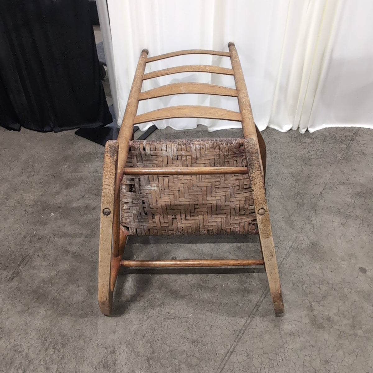 Brown Ladder-Back Rocking Chair with Woven Seat