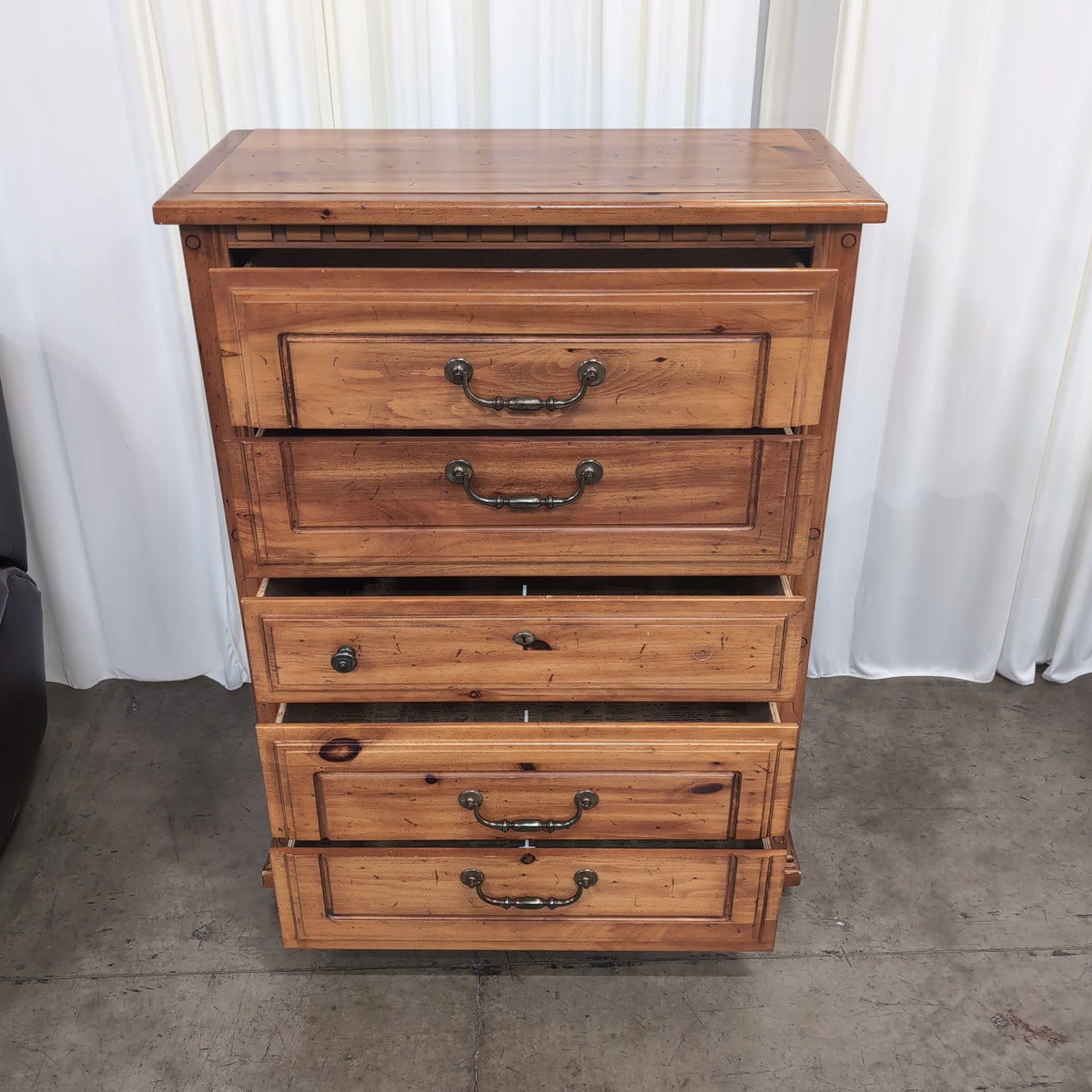 Honey-Toned Wood Four-Drawer Dresser with Decorative Molding