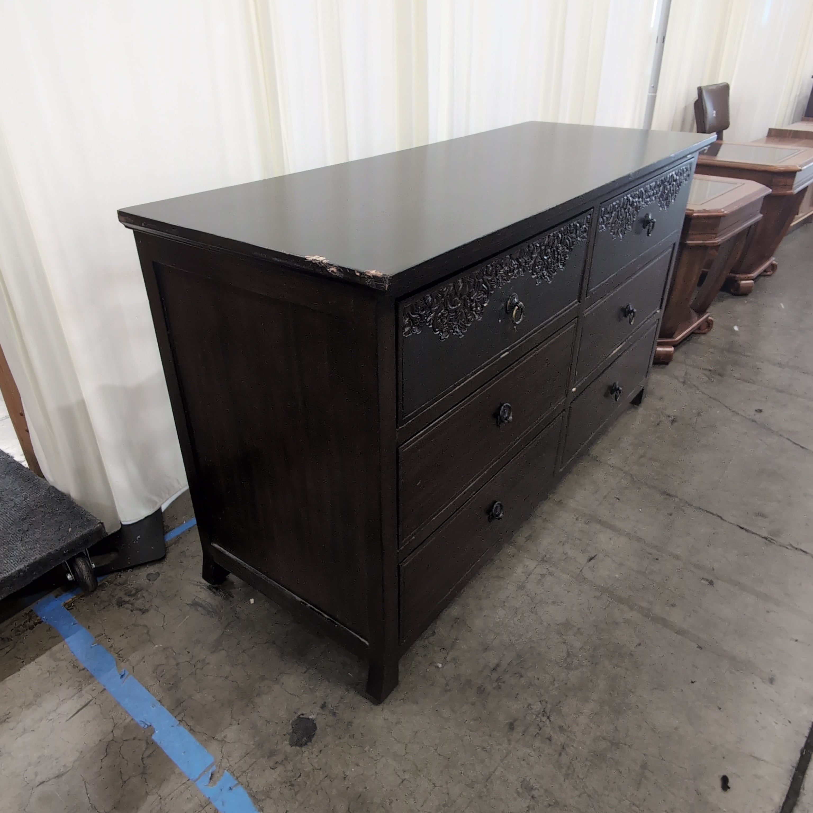 Dark Brown Six-Drawer Dresser with Ornate Carvings
