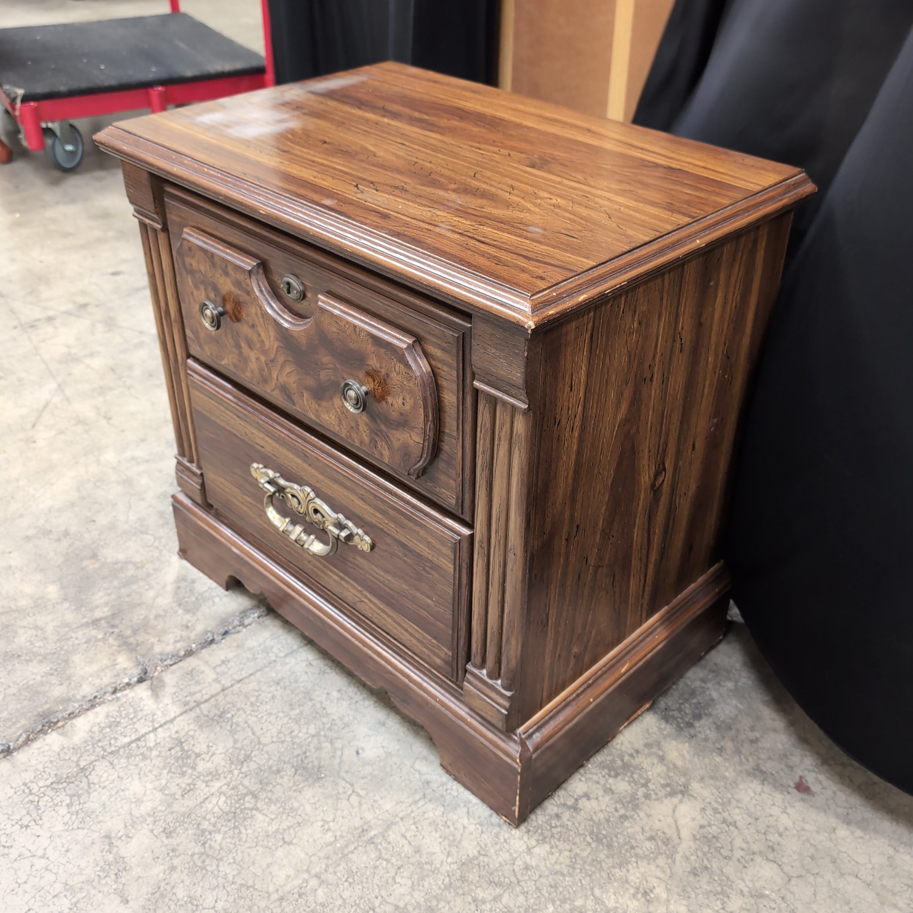Traditional Dark Wood Two-Drawer Nightstand with Ornate Hardware