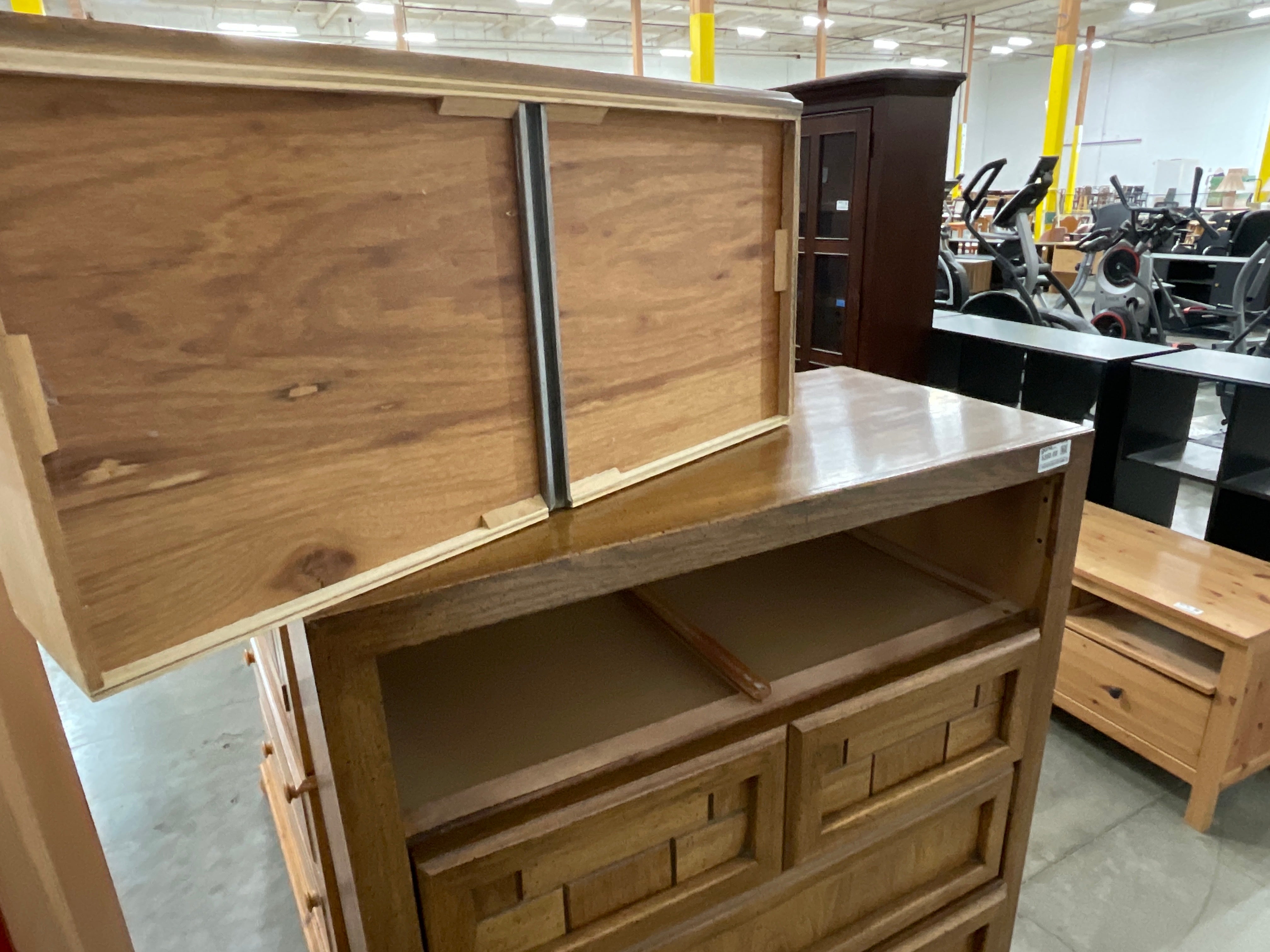 Honey Wood Five-Drawer Dresser with Geometric Top Panels
