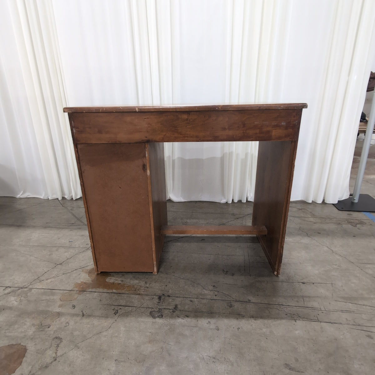 Brown Wood Four-Drawer Desk with Round Knobs