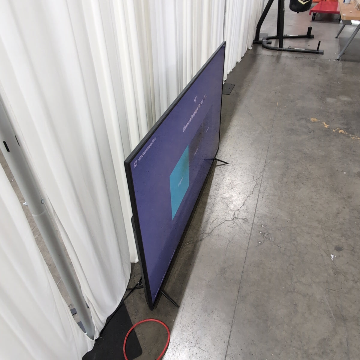 Large Black Flat Screen TV with Stand
