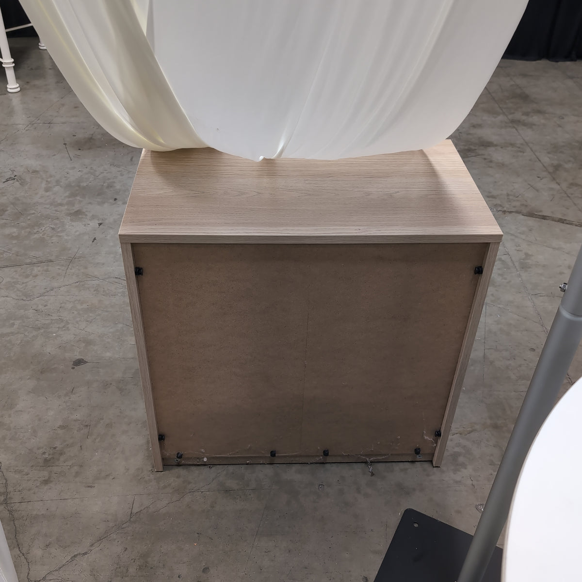 Light Wood Three-Drawer Nightstand with Recessed Pulls