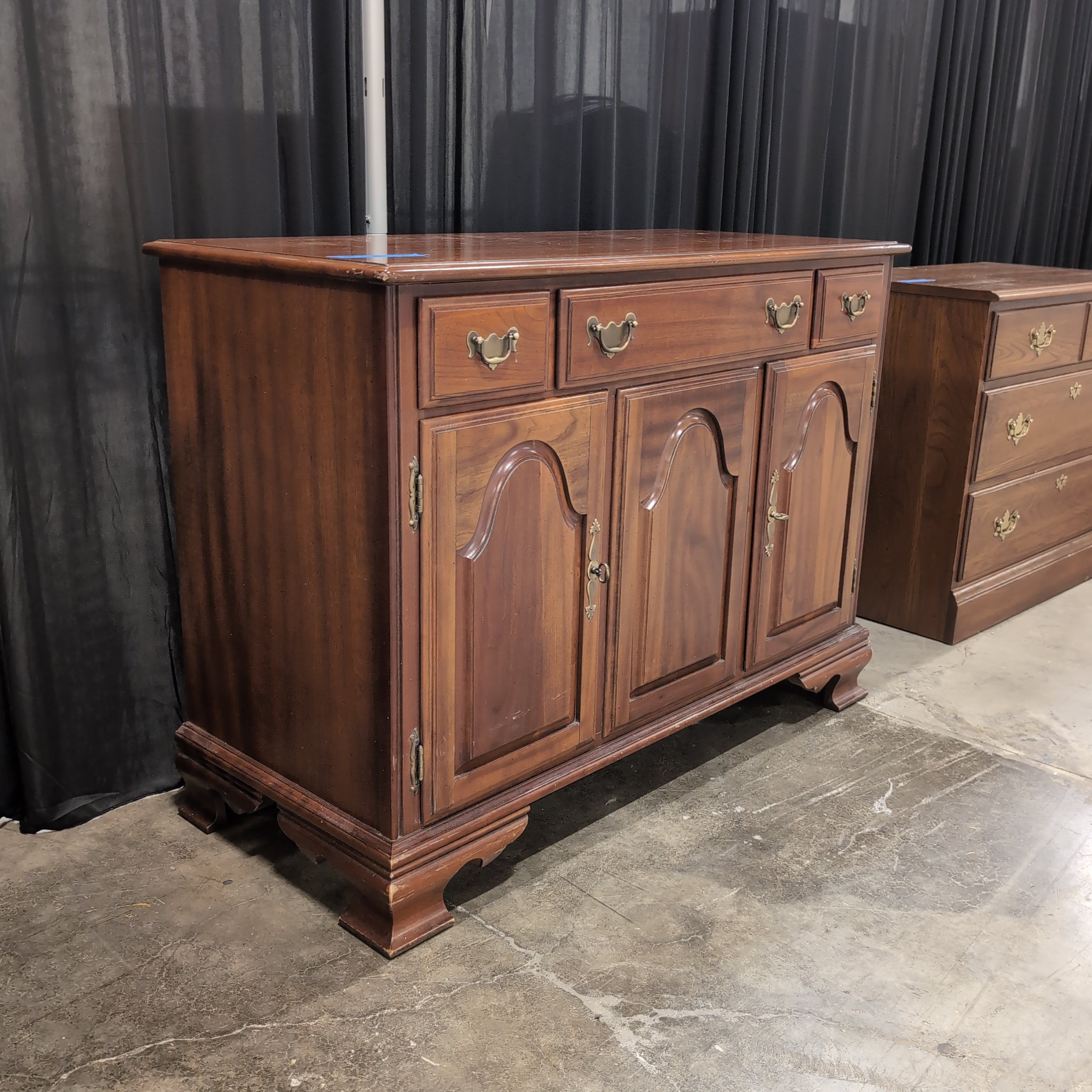 Traditional Cherry-Toned Wood Buffet with Ornate Hardware