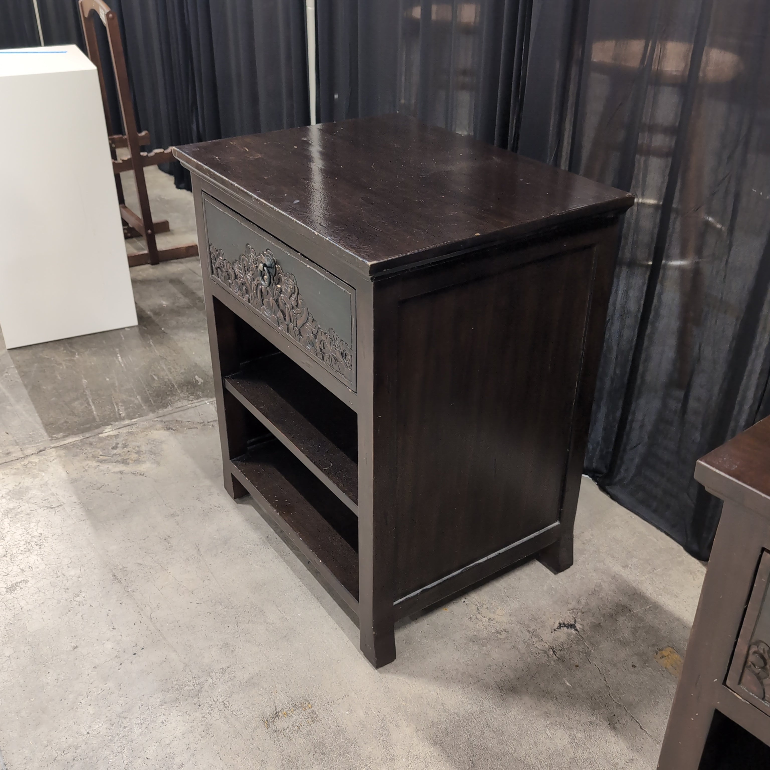 Dark Wood Nightstand with Carved Drawer Front