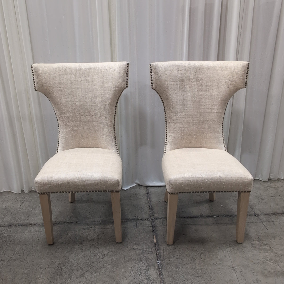 Light Beige Upholstered High-Back Chair with Nailhead Trim
