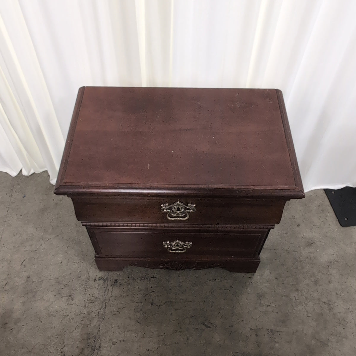 Traditional Dark Wood Two-Drawer Nightstand with Ornate Hardware