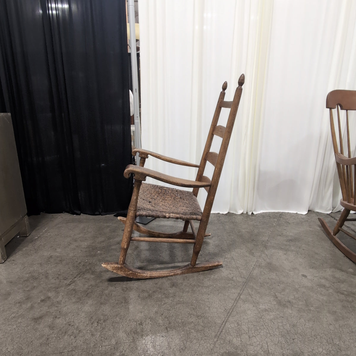 Brown Ladder-Back Rocking Chair with Woven Seat