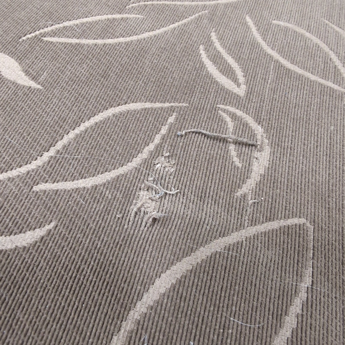 Tan Upholstered Chaise Lounge with Leaf Pattern