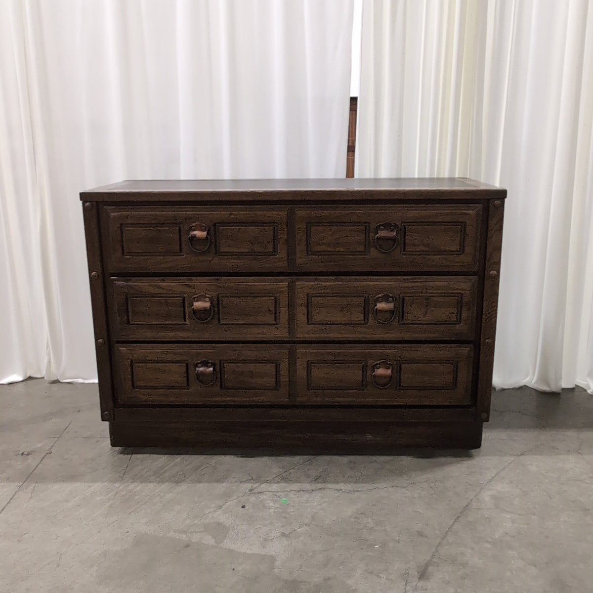 Traditional Dark Wood Four-Drawer Dresser with Ornate Pulls