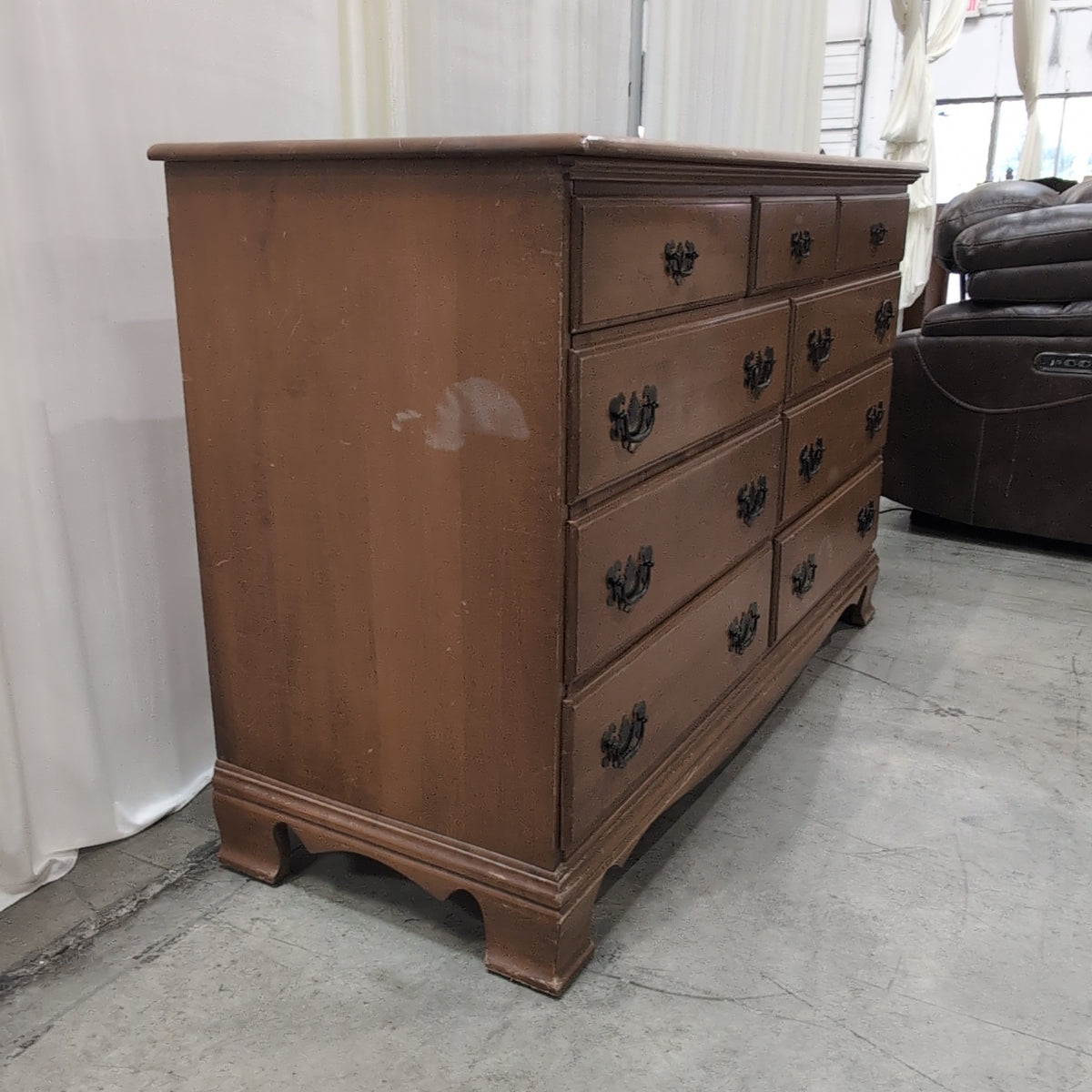 Traditional Honey Tone Nine-Drawer Dresser with Ornate Hardware
