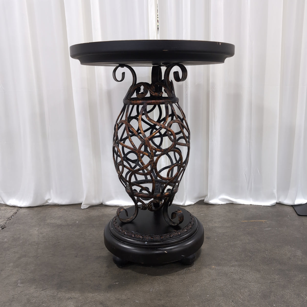 Round Dark Wood End Table with Ornate Metal Base