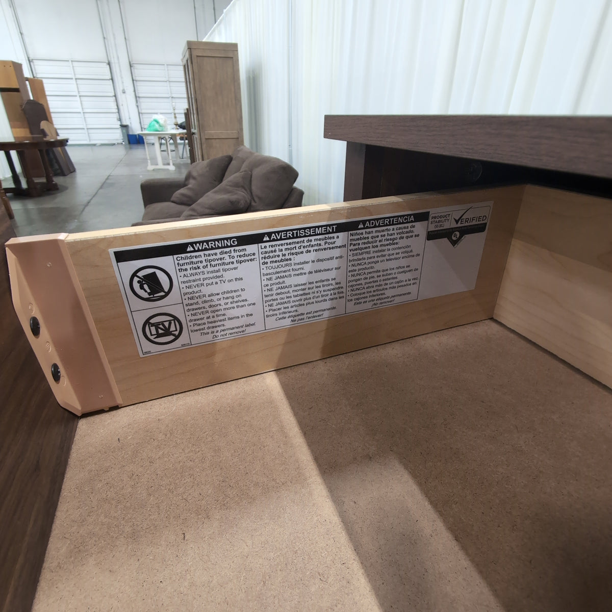 Dark Wood Four-Drawer Dresser with Metal Pulls