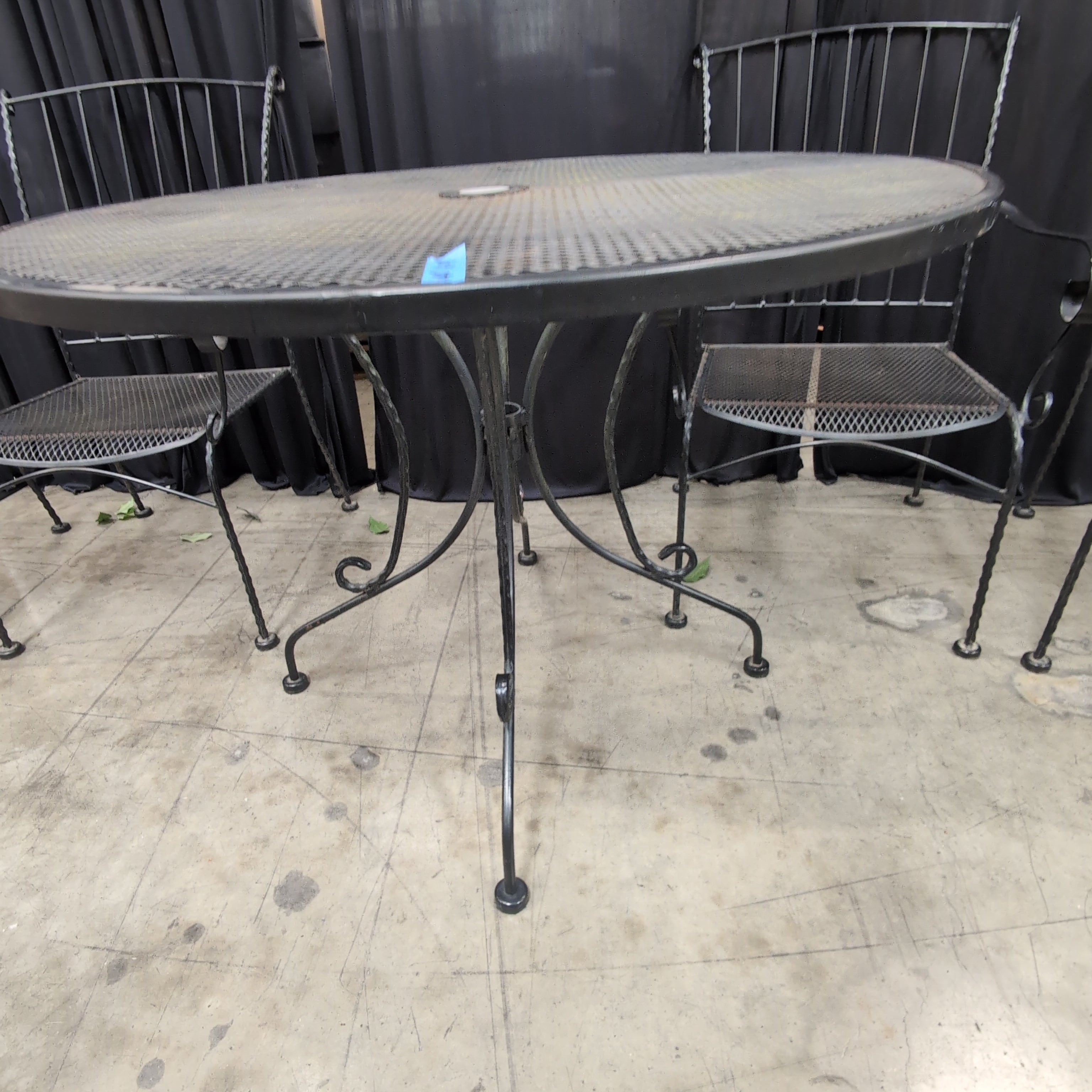 Black Wrought Iron Round Outdoor Table and Four Chairs