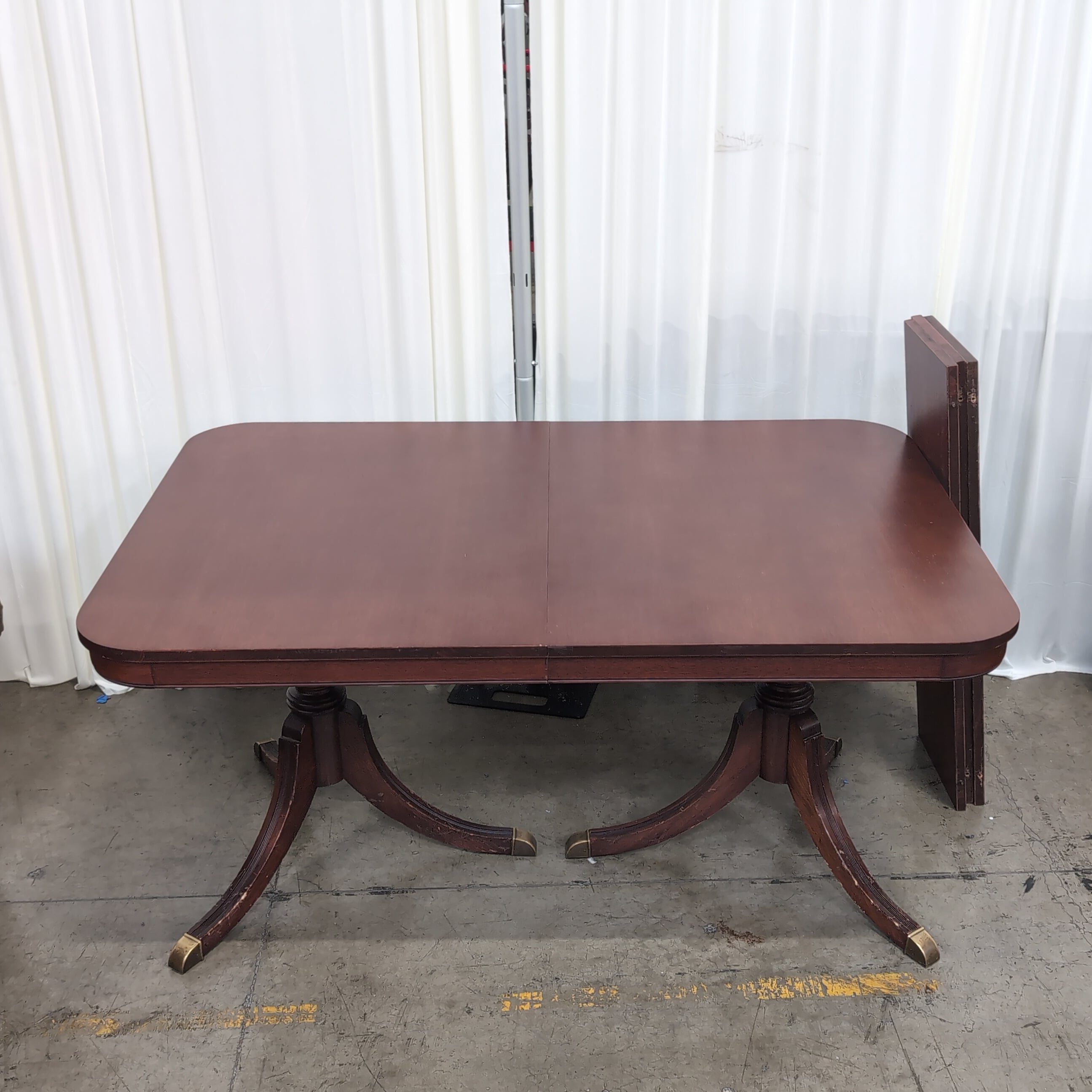 Reddish Brown Hardwood Dining Table with Rounded Corners