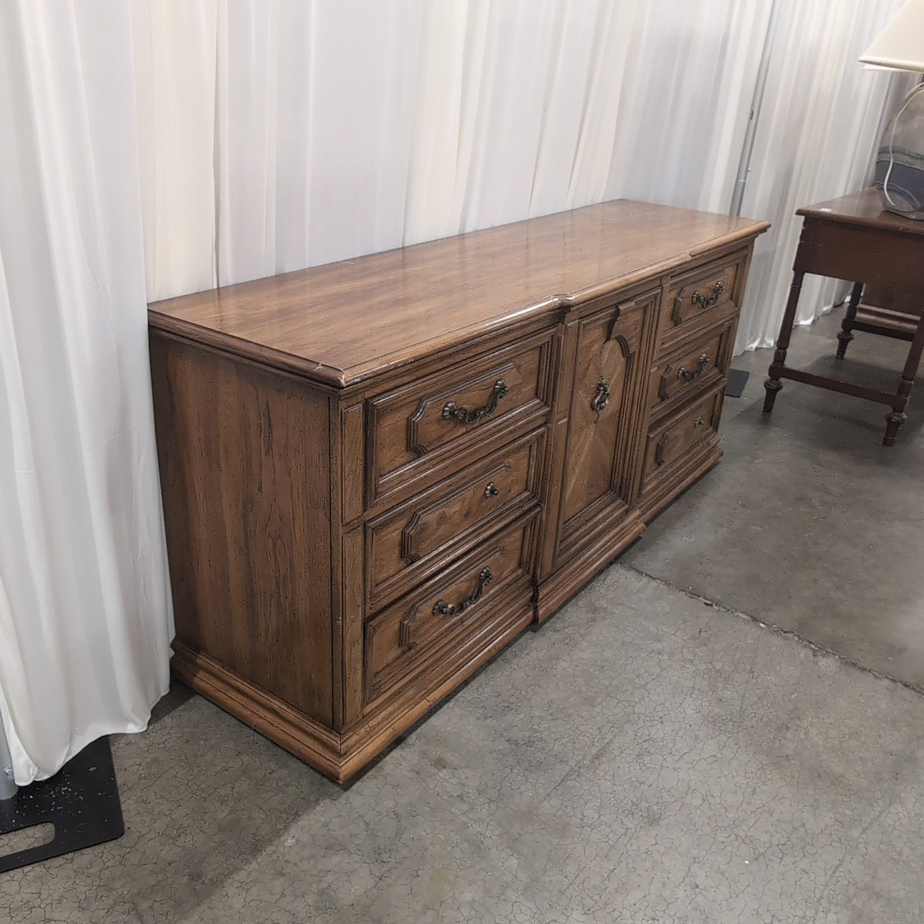 Traditional Brown Wood Dresser with Ornate Hardware