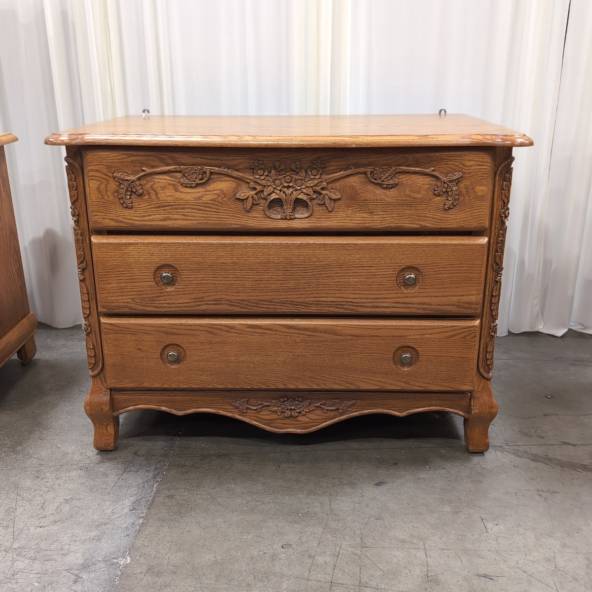 Ornate Carved Wood Three-Drawer Dresser with Floral Motifs