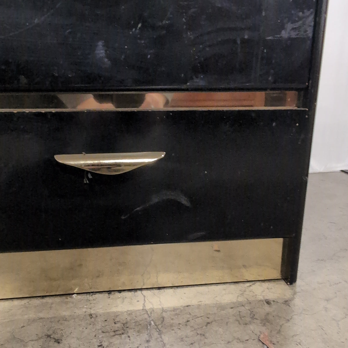 Black Lacquer Four-Drawer Dresser with Gold Pulls