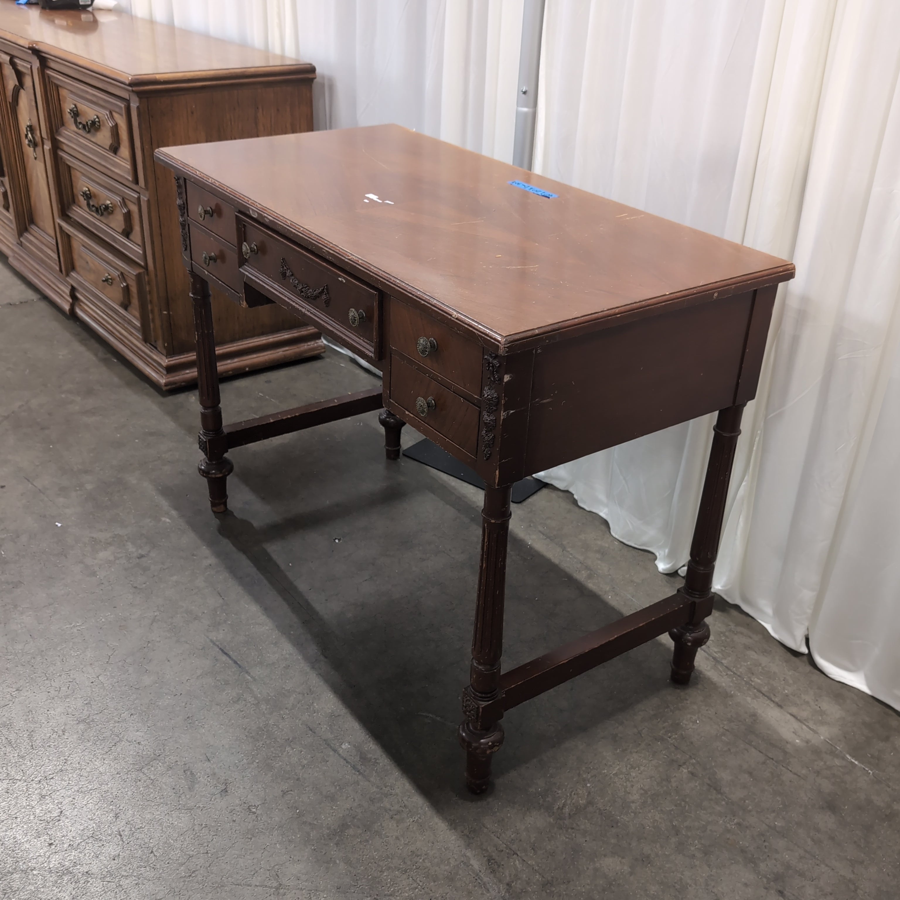 Traditional Reddish-Brown Wood Desk with Ornate Legs