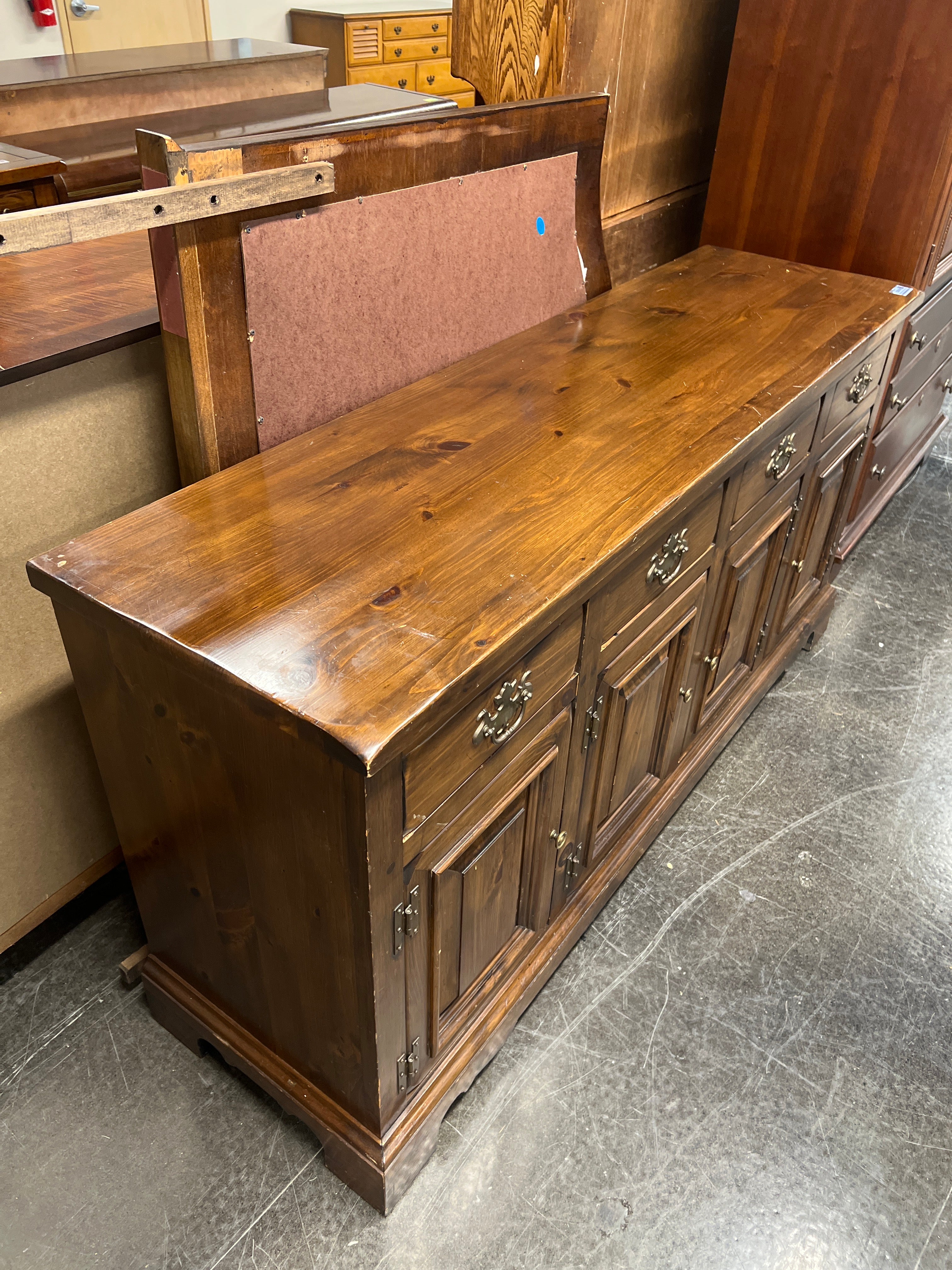 Rustic Dark Stained Wood Sideboard with Ornate Hardware