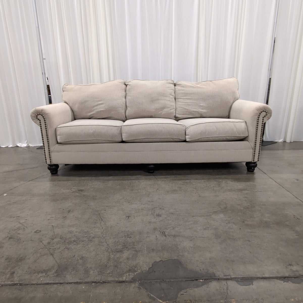 Light Beige Fabric Couch with Nailhead Trim