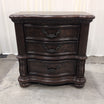 Dark Wood Three-Drawer Nightstand with Ornate Hardware
