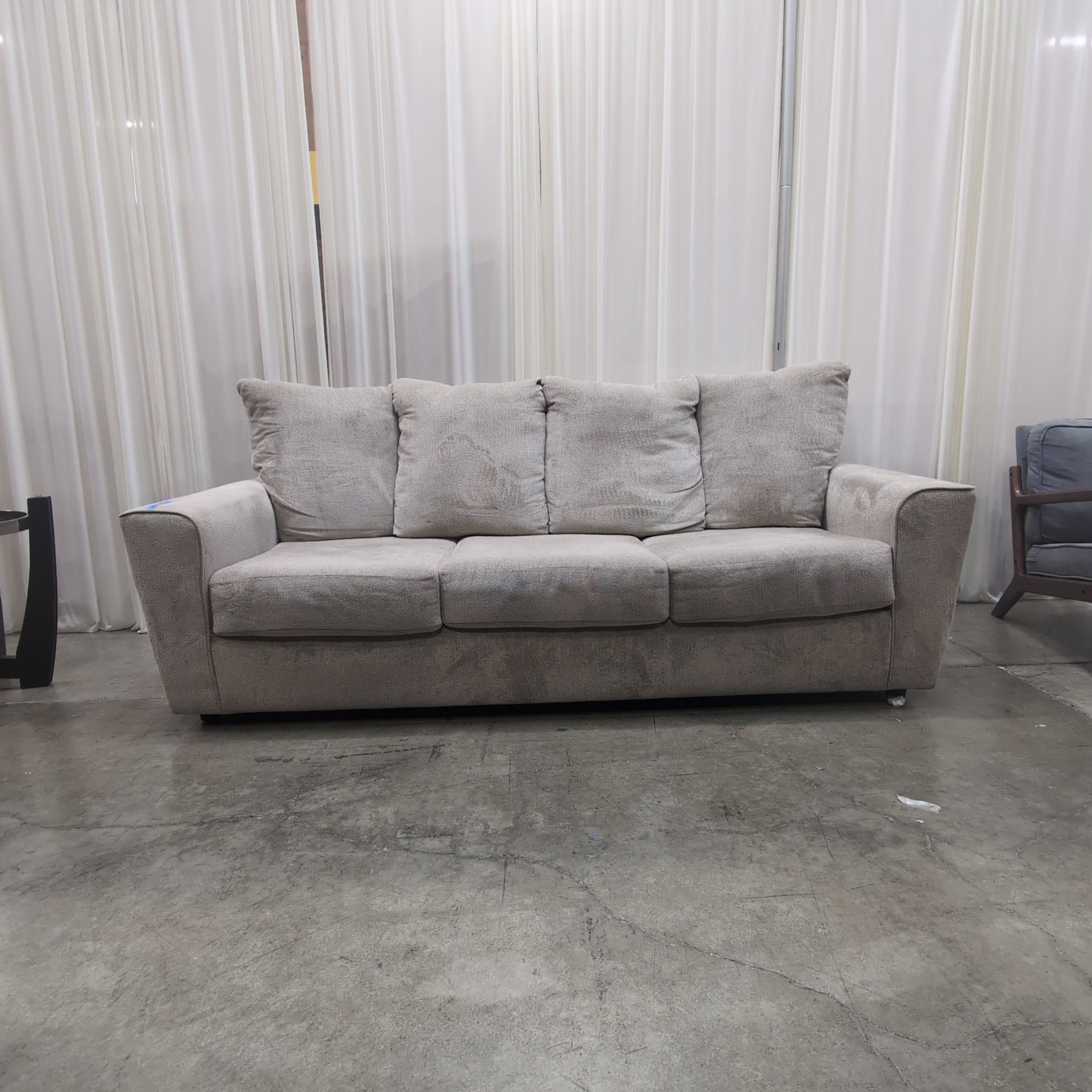 Light Beige Upholstered Three-Seat Couch