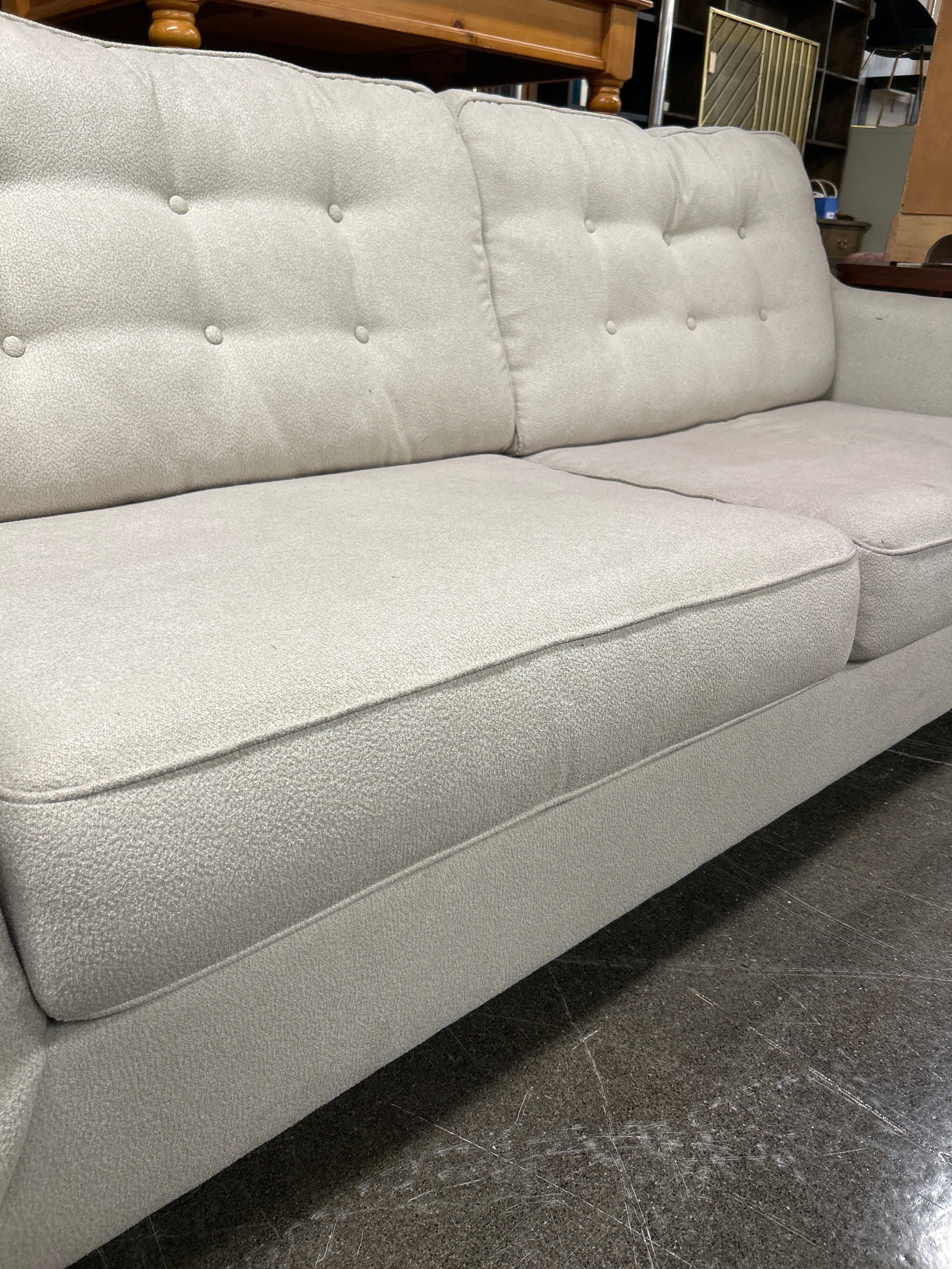 Ashley Furniture 2 Seat Cream Cloth Sofa