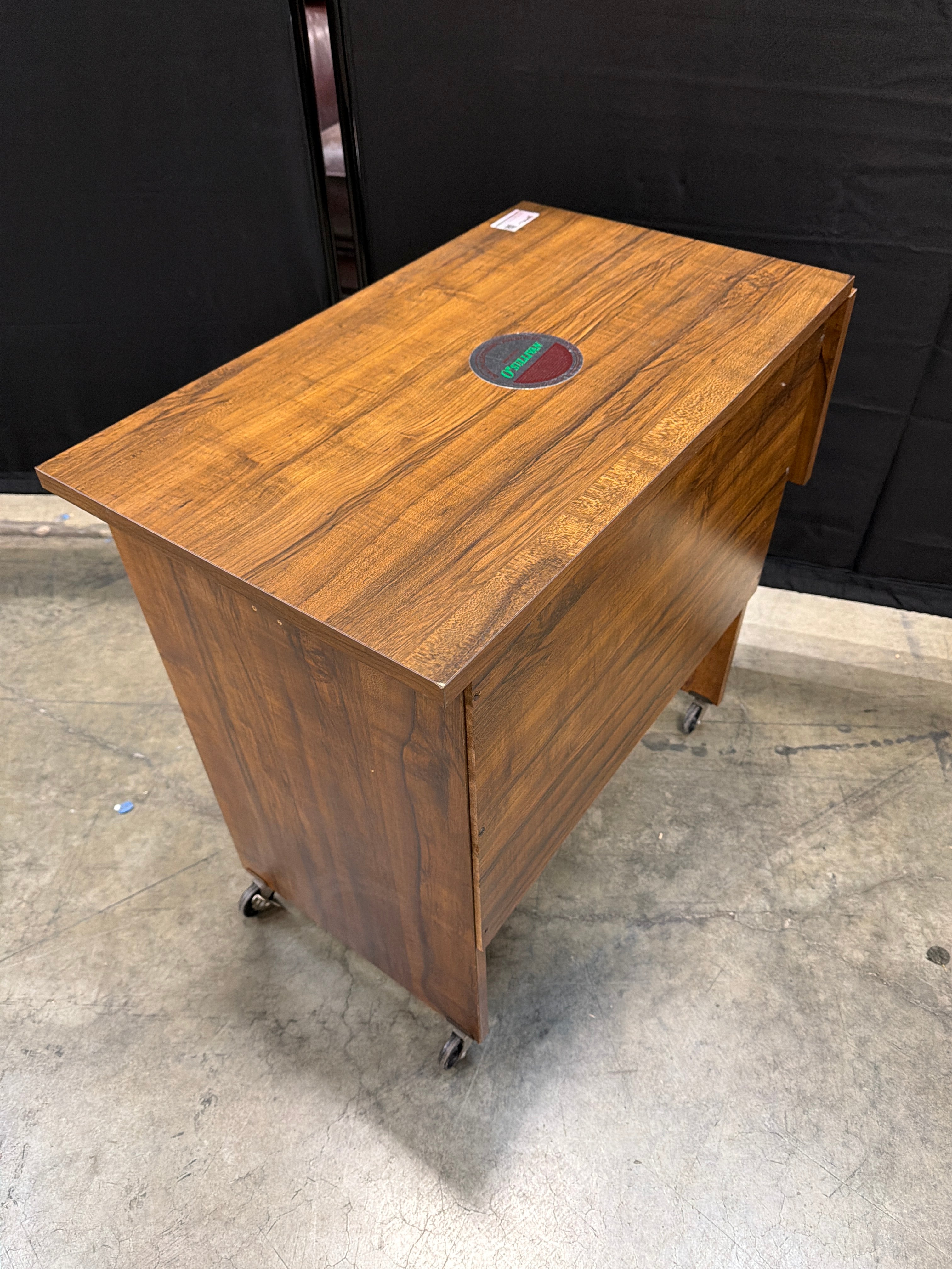 O’Sullivan Rectangular Wood Utility Table with Folding Leaf and Rolling Casters