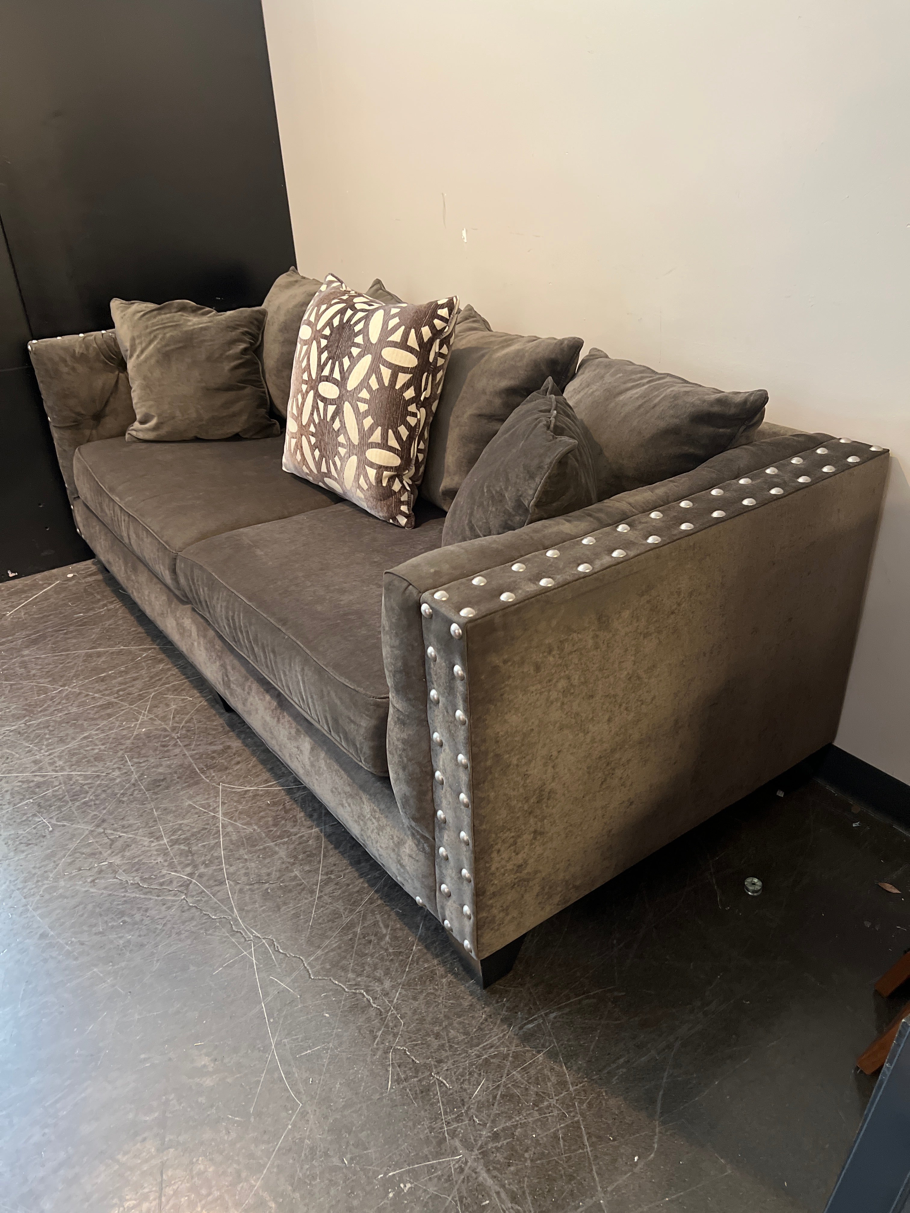 Dark Brown Tufted Sofa with Metal Accents