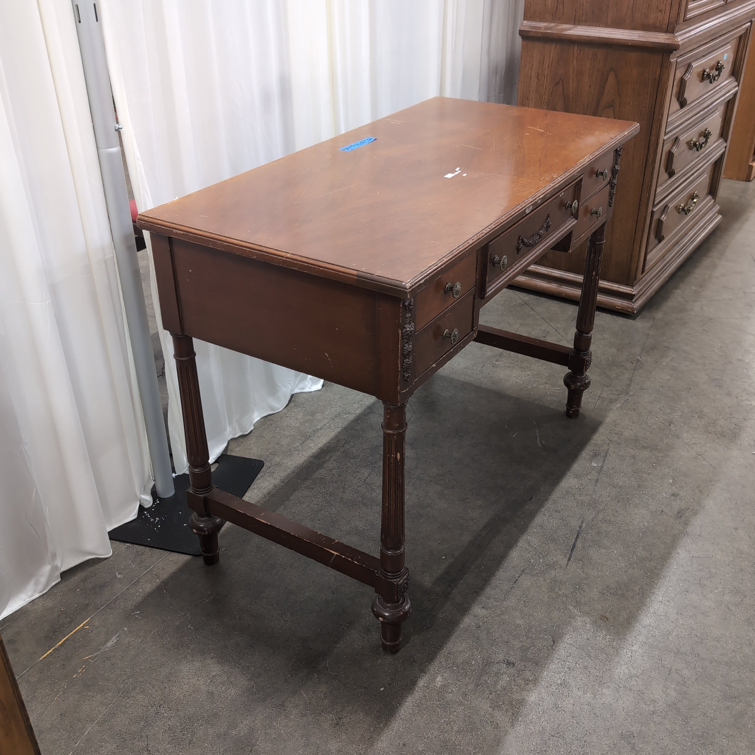 Traditional Reddish-Brown Wood Desk with Ornate Legs
