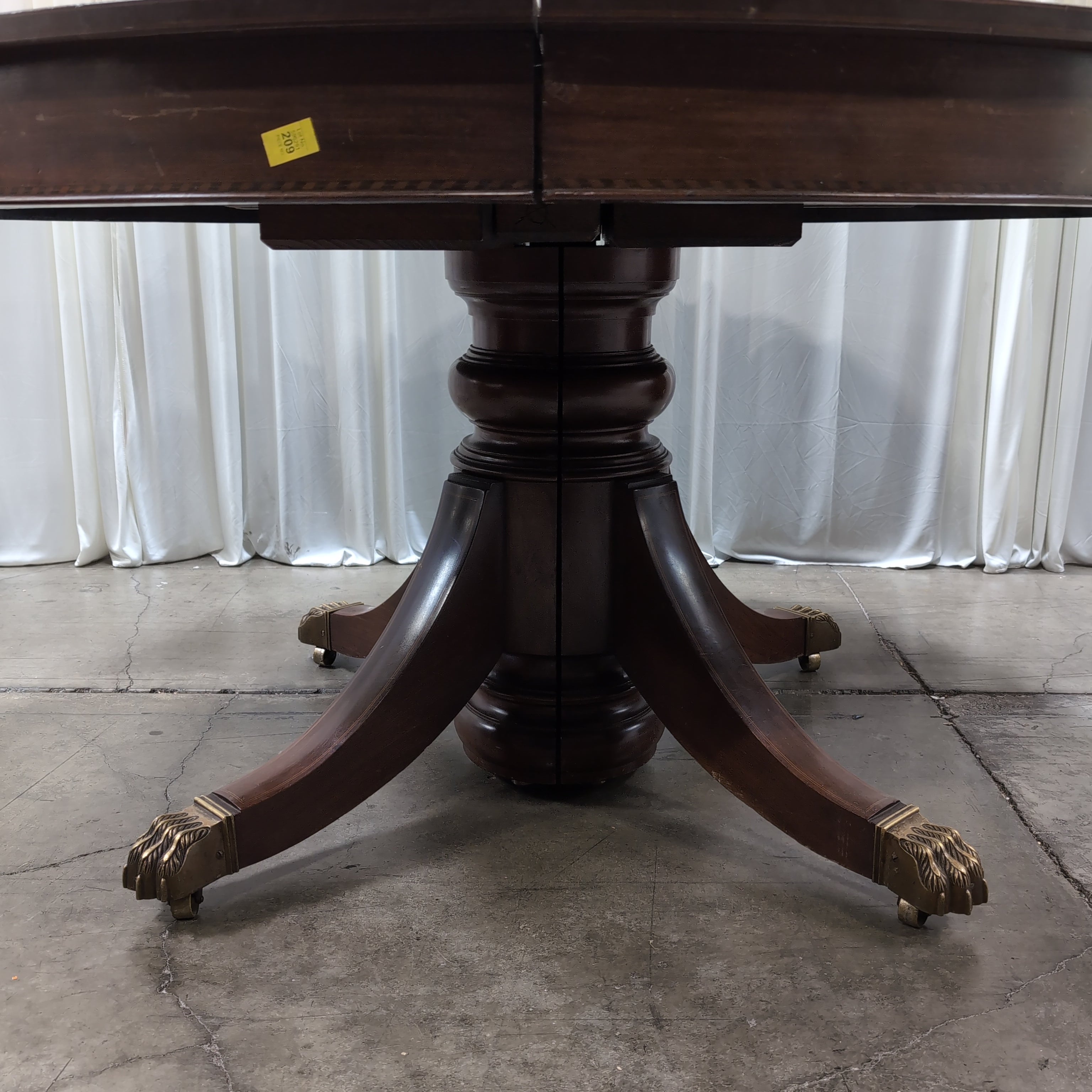 Round Dark Wood Pedestal Dining Table with Claw Feet