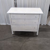 White Wood Three-Drawer Dresser with Round Knobs