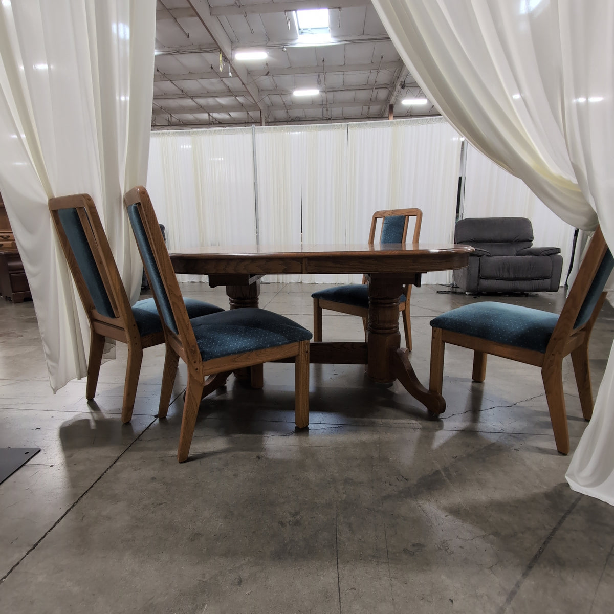Reddish Brown Oval Pedestal Dining Table