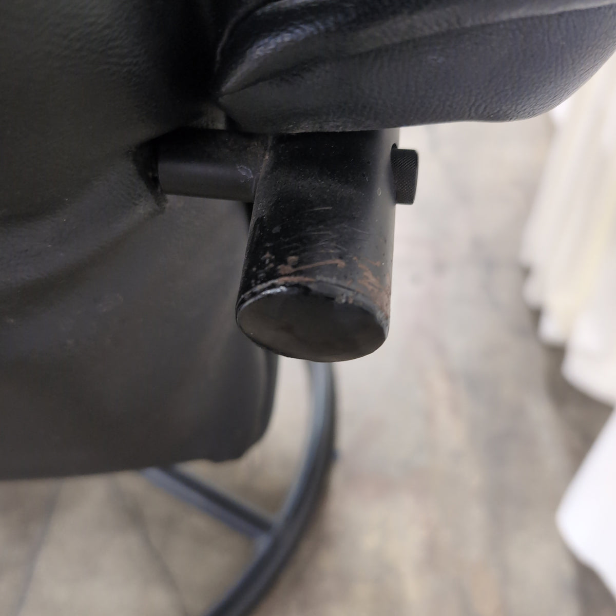 Black Tufted Leather Swivel Recliner with Ottoman