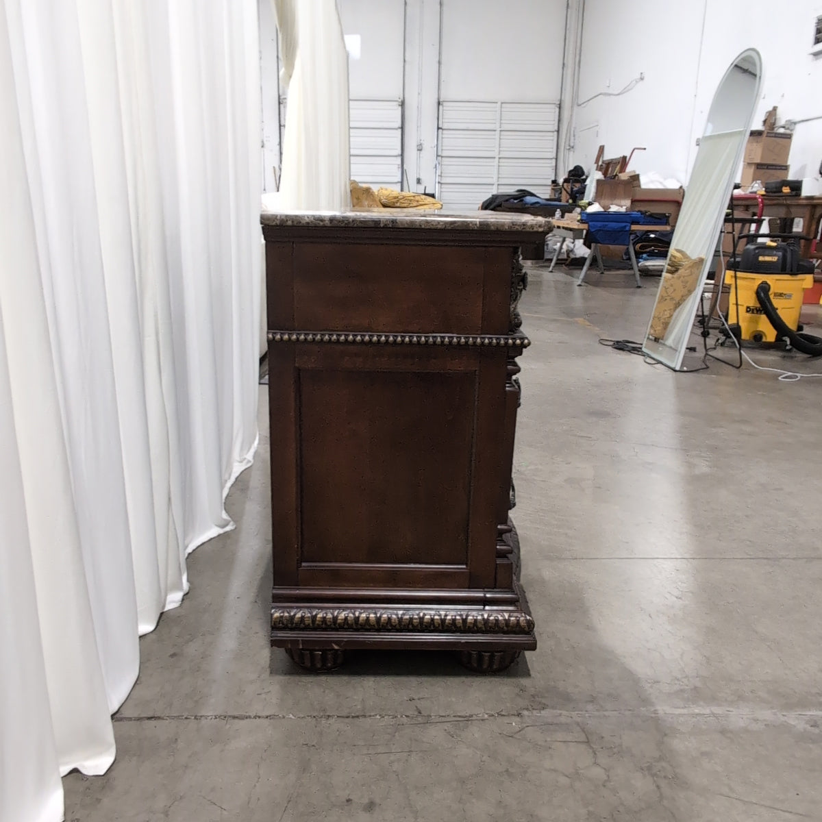 Ornate Dark Wood Three-Drawer Nightstand with Marble Top