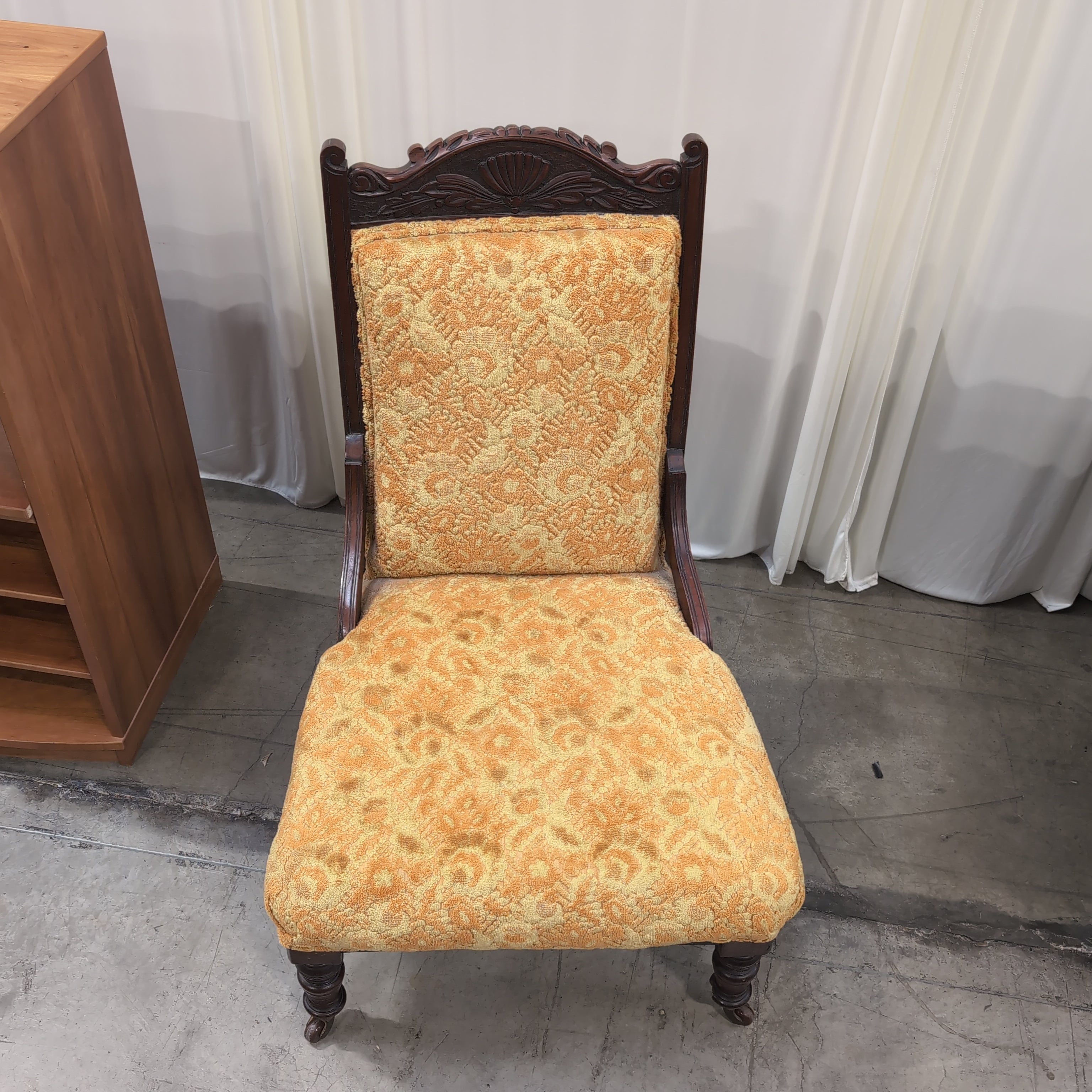 Carved Dark Wood Accent Chair with Patterned Upholstery