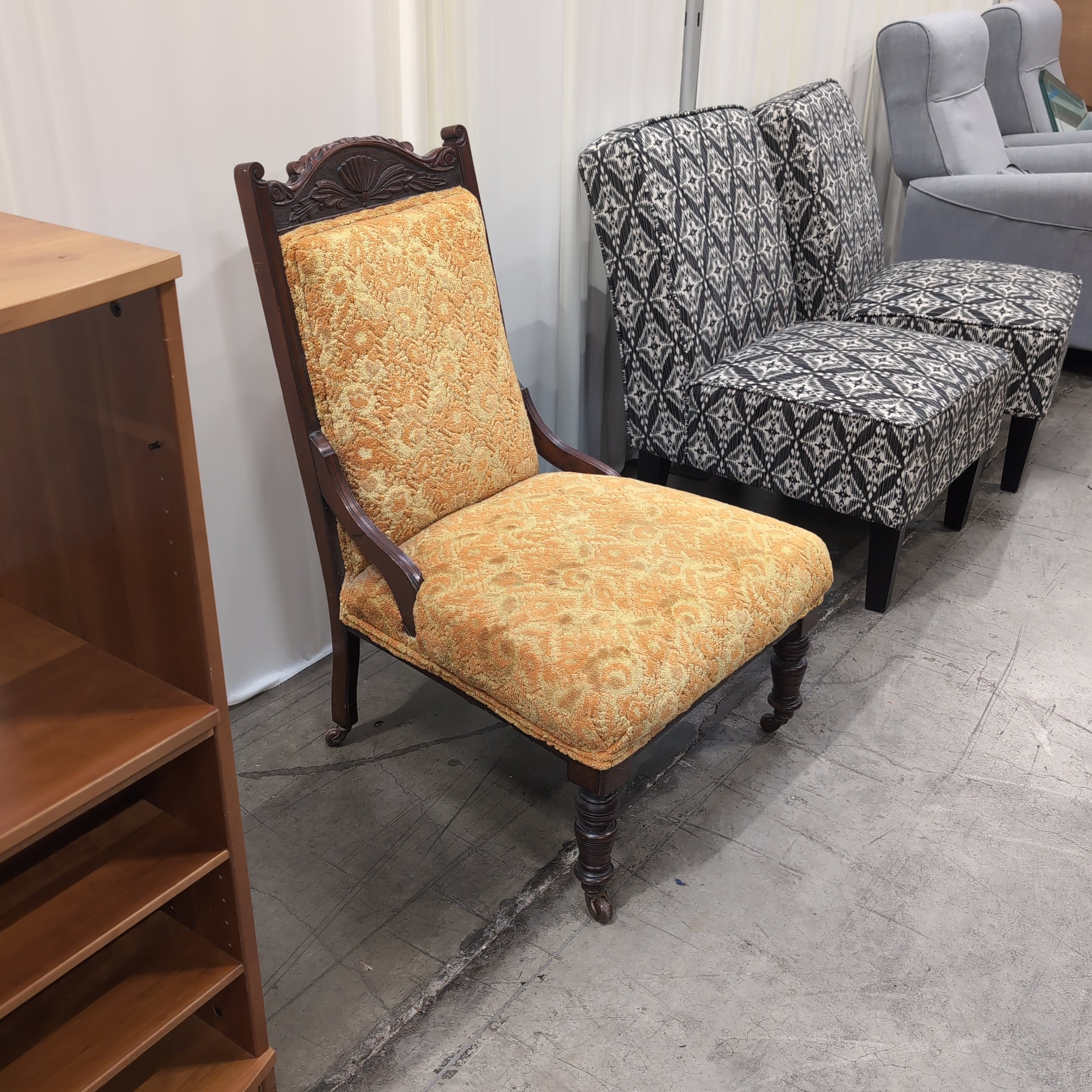Carved Dark Wood Accent Chair with Patterned Upholstery