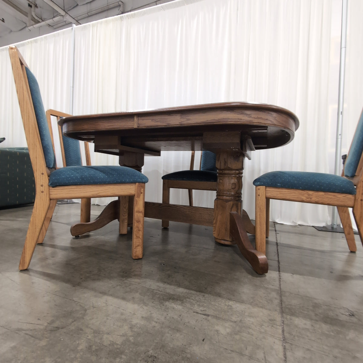 Reddish Brown Oval Pedestal Dining Table