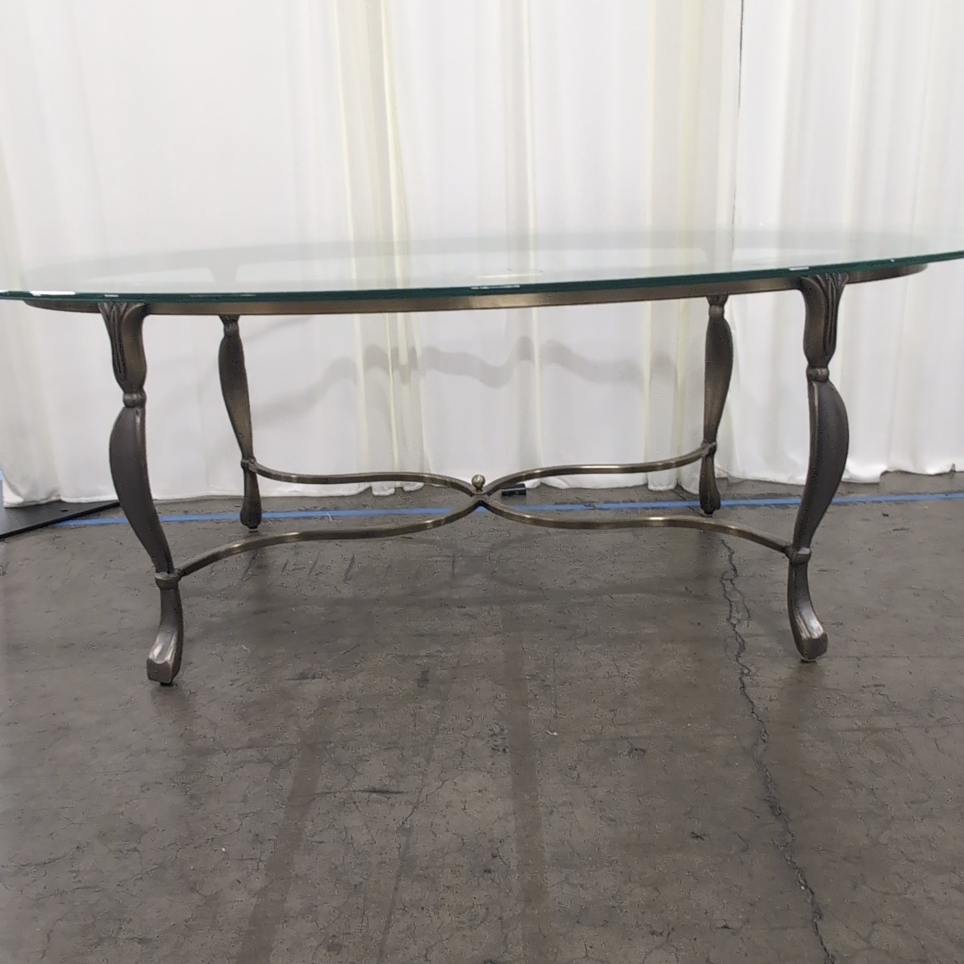 Oval Glass Coffee Table with Ornate Metal Base
