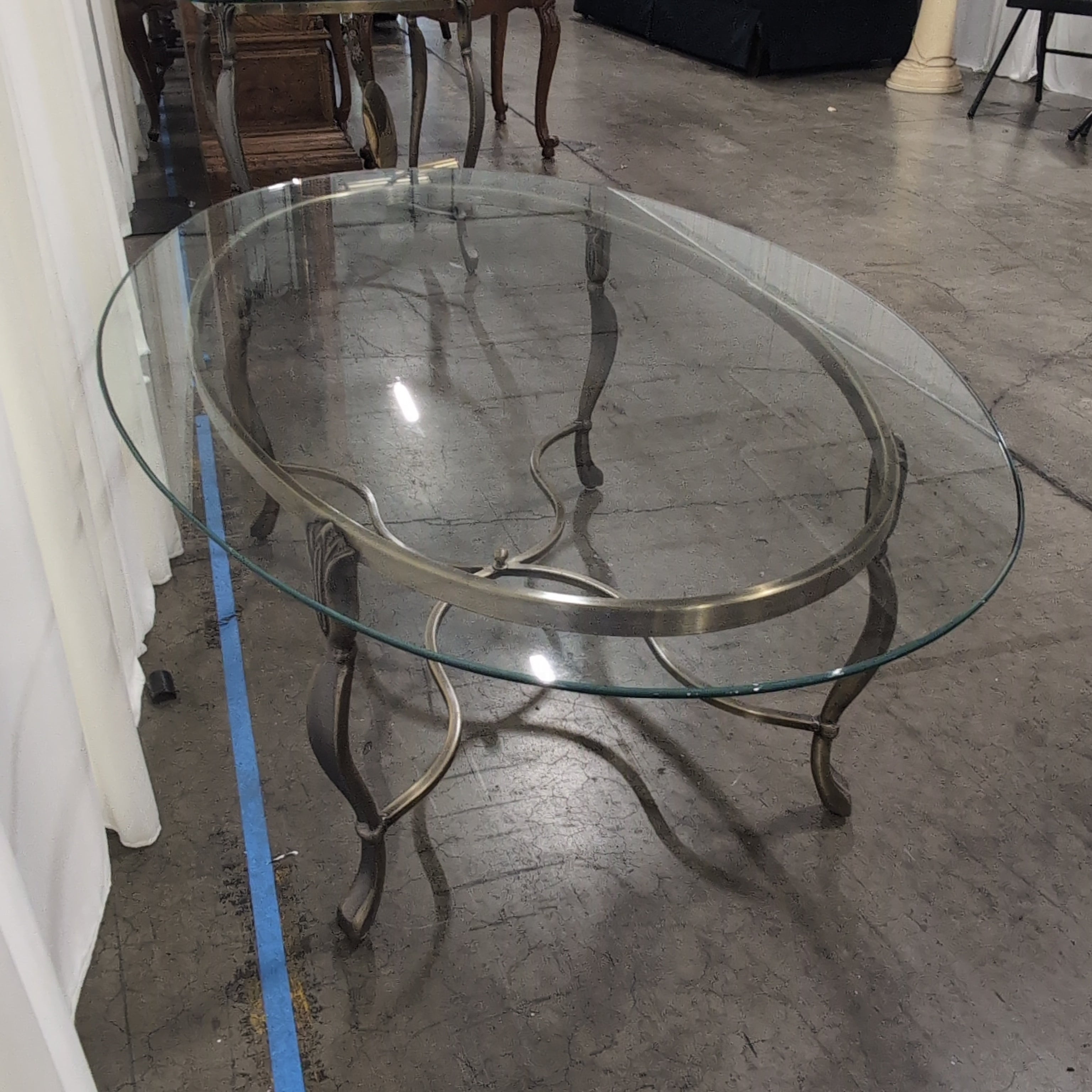 Oval Glass Coffee Table with Ornate Metal Base