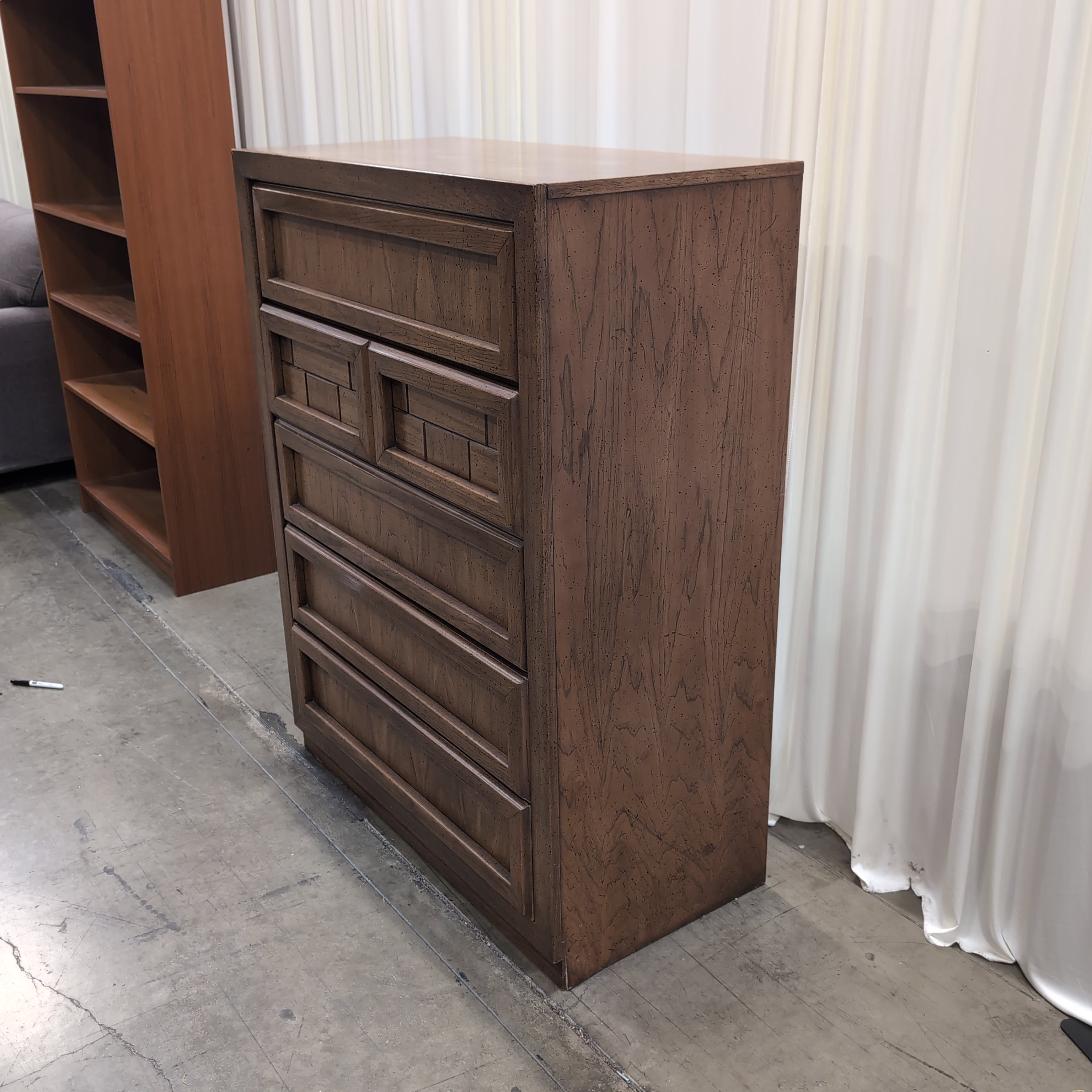 Honey Wood Five-Drawer Dresser with Geometric Top Panels