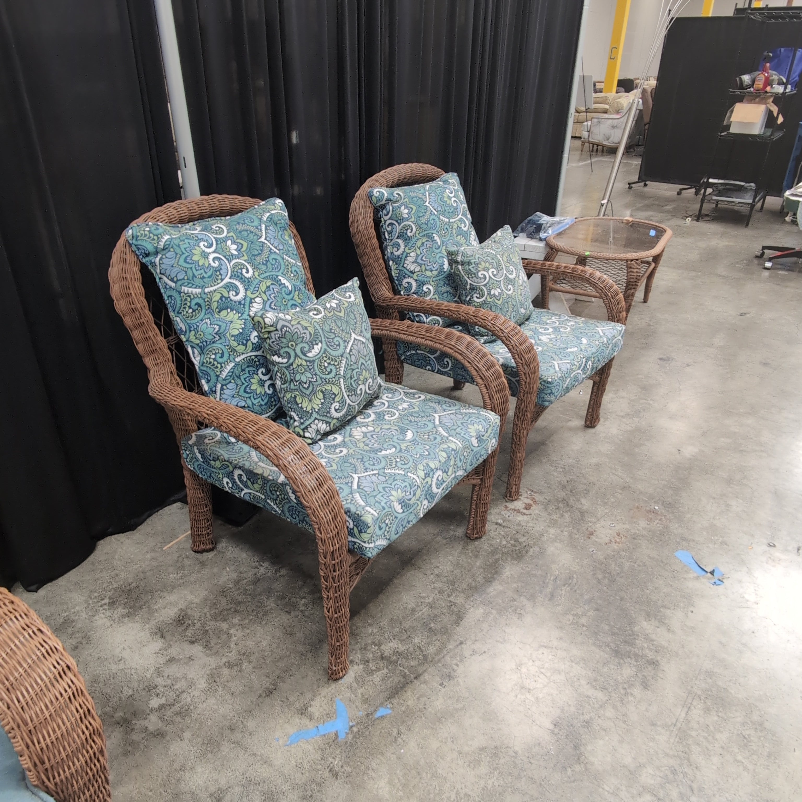 Pair of Brown Wicker Outdoor Chair with Patterned Cushions