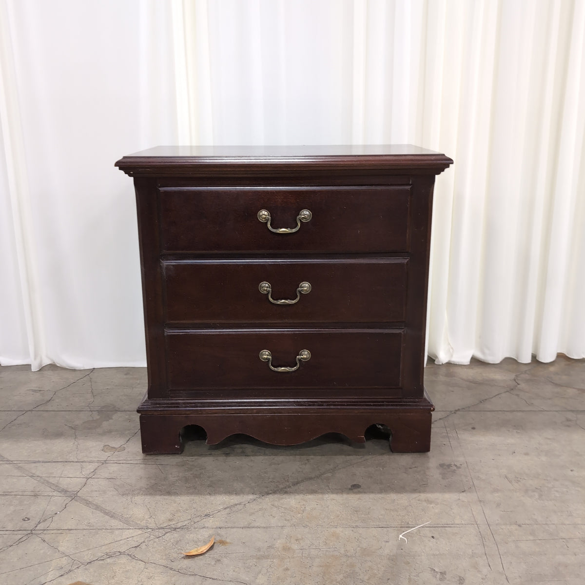 Mahogany Finish Three-Drawer Nightstand with Ornate Hardware