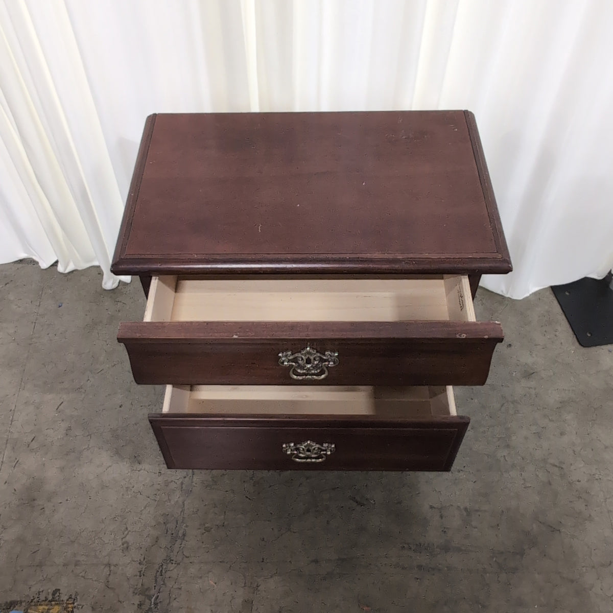 Traditional Dark Wood Two-Drawer Nightstand with Ornate Hardware