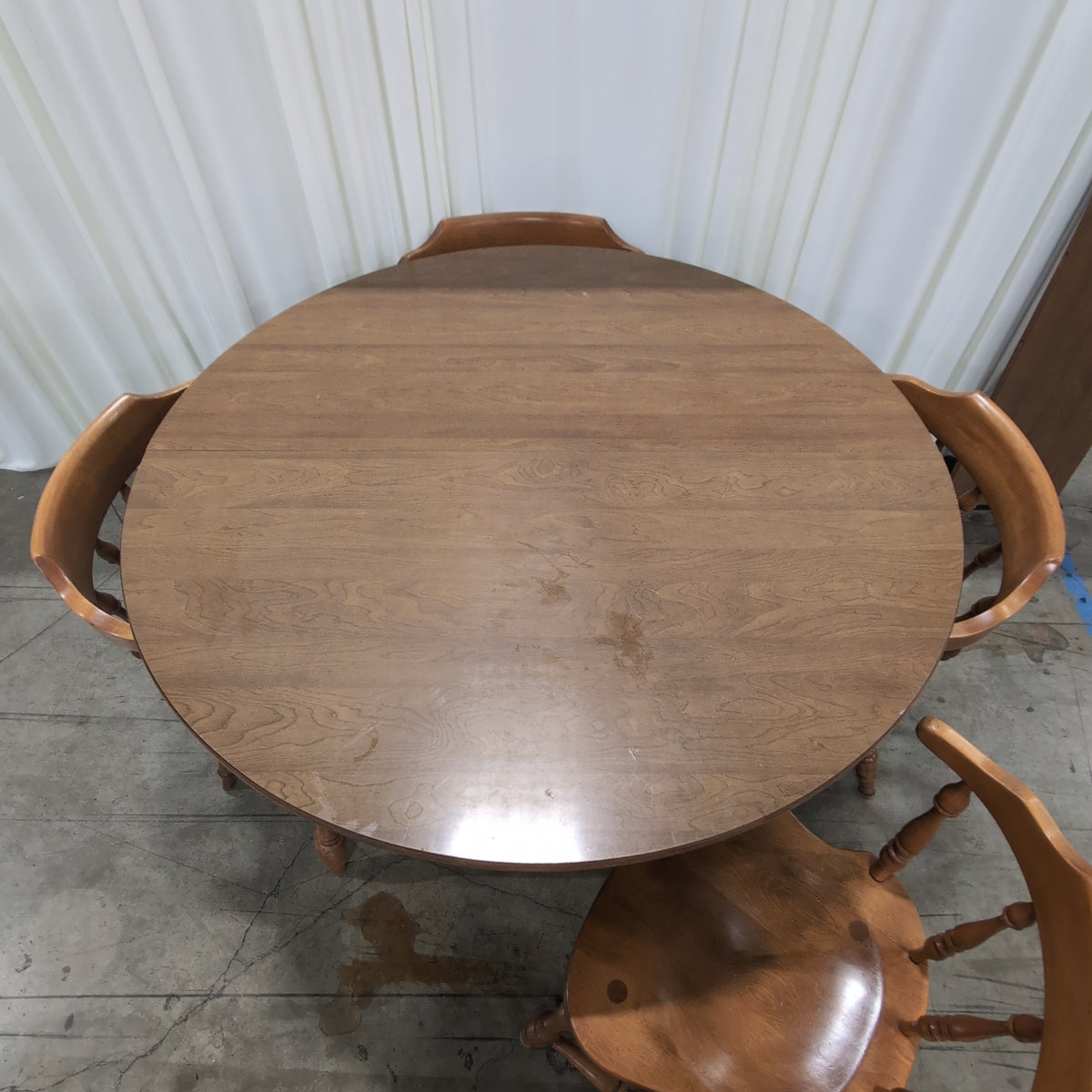 Round Medium Brown Wood Dining Table with Leaf Seam