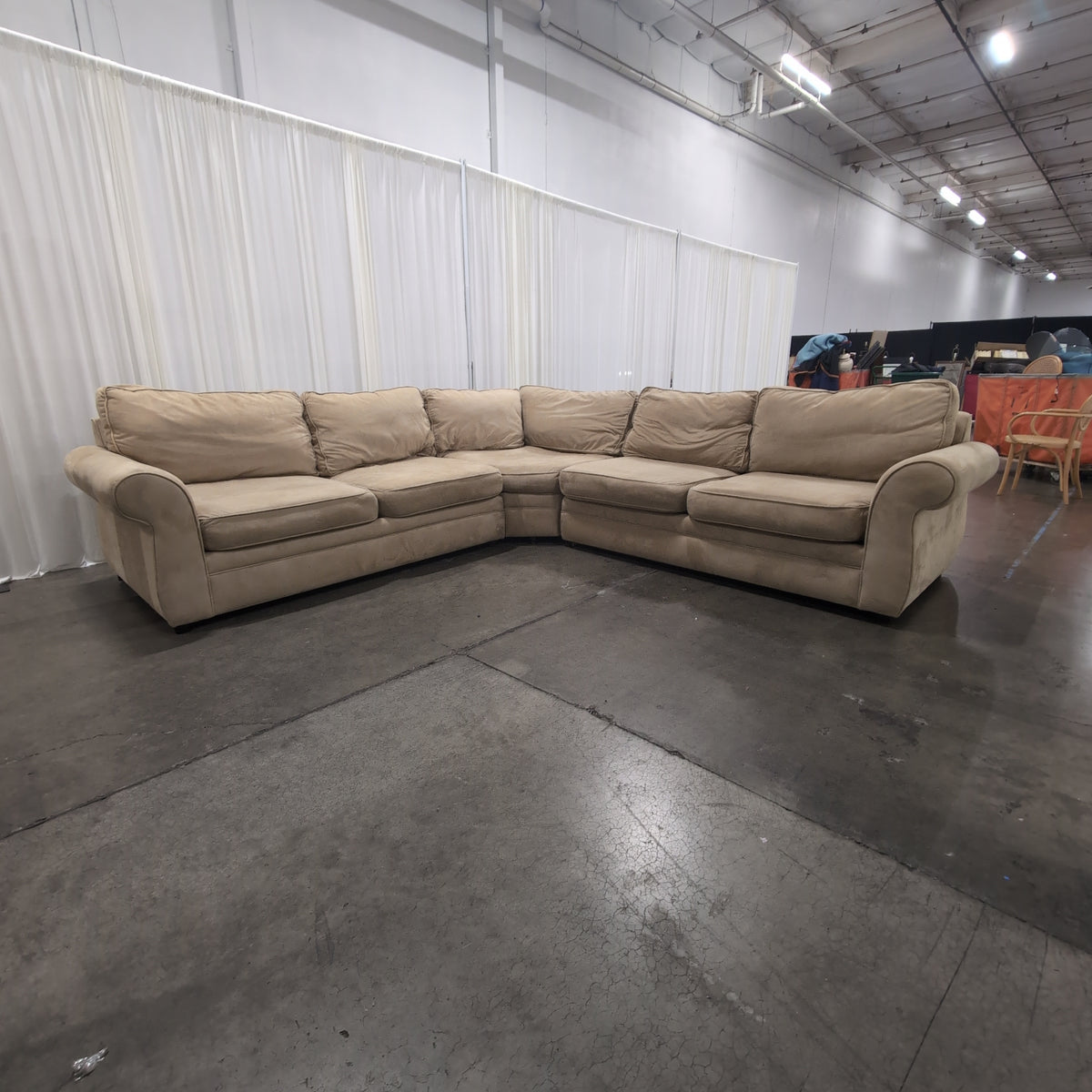 Tan L-Shaped Sectional Couch with Rolled Arms