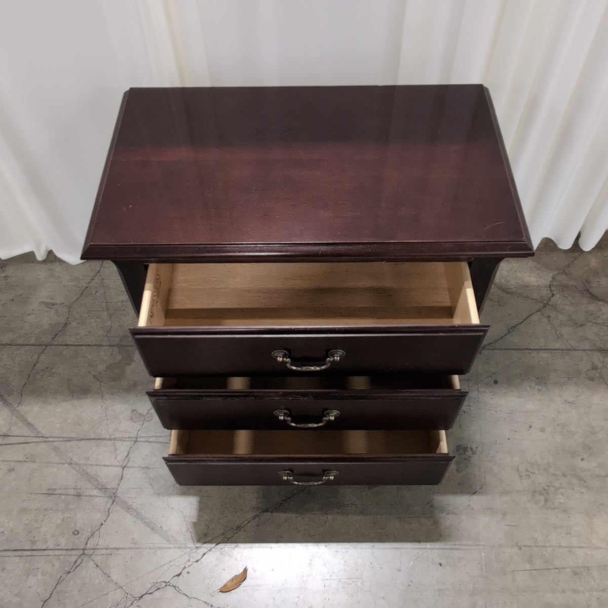Mahogany Finish Three-Drawer Nightstand with Ornate Hardware